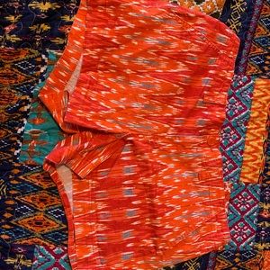 Orange Calvin Klein jean shorts